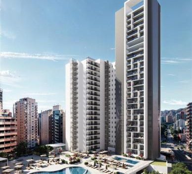Port Benidorm Hotel & Spa Modern high-rise building with unique architectural design and swimming pool in the foreground.